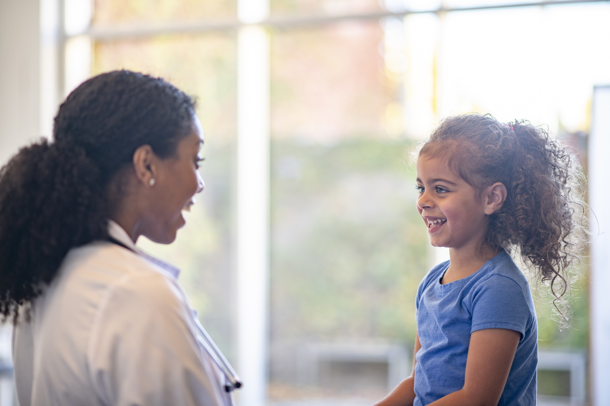 school nurse talking with child patient