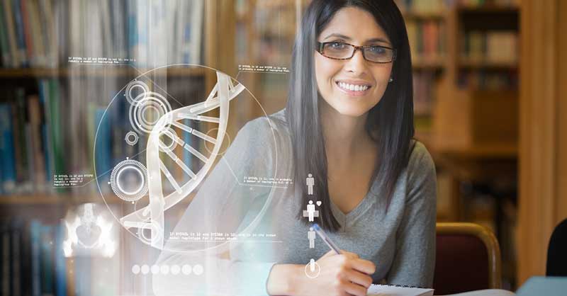 Woman sitting at desk with overlay of x-ray shot of DNA